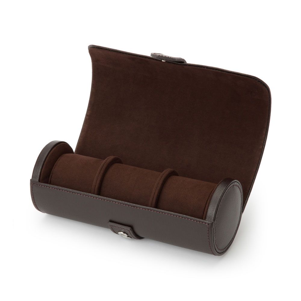The WOLF 1834 Blake Triple Watch Roll Brown by WOLF is a handcrafted dark brown leather watch roll with a soft suede interior, shown open and empty, featuring three compartments for storing watches—exemplifying both elegance and functionality.