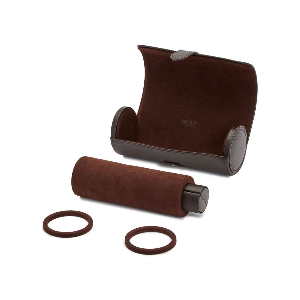 A WOLF 1834 Blake Triple Watch Roll in brown suede and leather features a removable cylindrical holder and two circular watch cushions displayed in front.