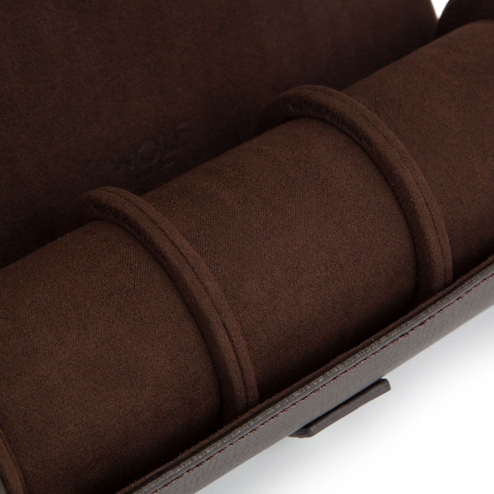 Close-up of the WOLF 1834 Blake Triple Watch Roll in brown by WOLF, featuring three slots and showcasing its soft, padded suede or velvet material with detailed stitching.
