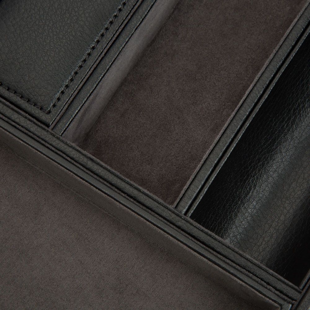 Close-up of the WOLF 1834 Blake Valet Jewellery and Watch Tray With Cuff by WOLF, open to show multiple storage compartments, highlighting its textured leather exterior and soft suede-like interior details.