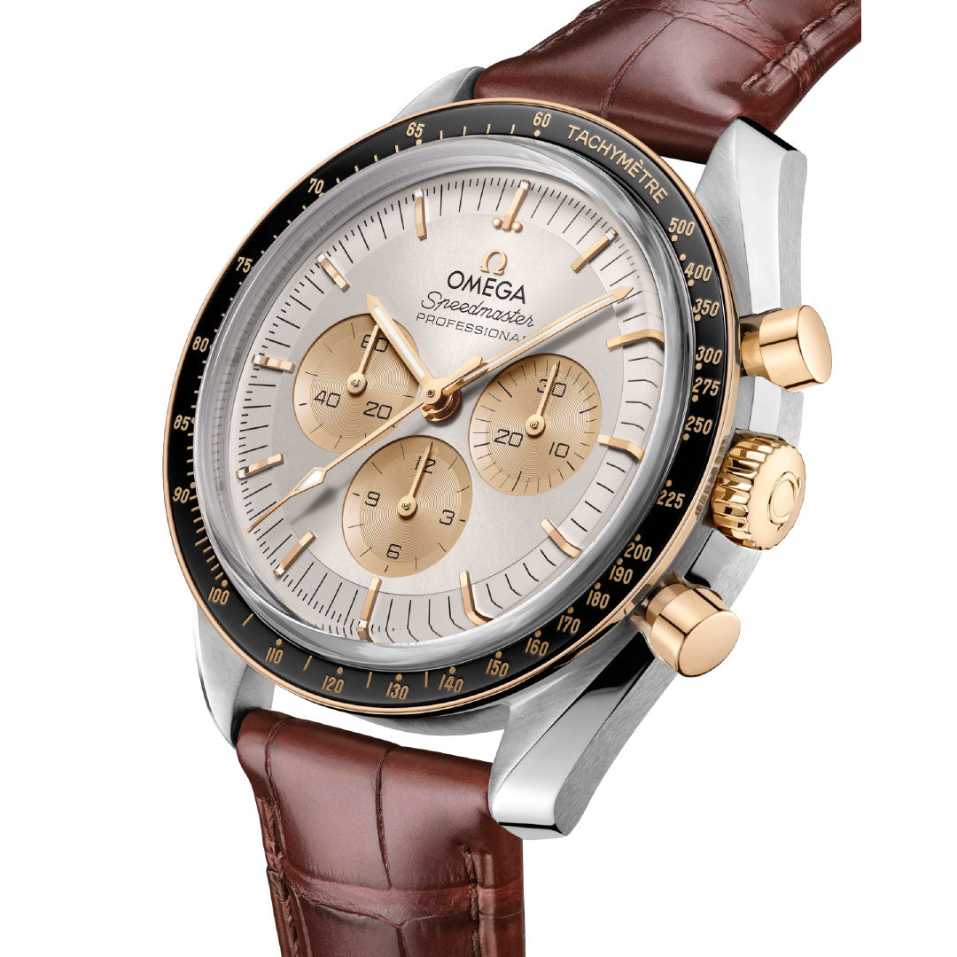The OMEGA Speedmaster Moonwatch Professional Co-Axial Master Chronometer Chronograph 42mm features a brown leather strap, gold bezel, gold chronograph dials, silver face, and tachymeter scale.