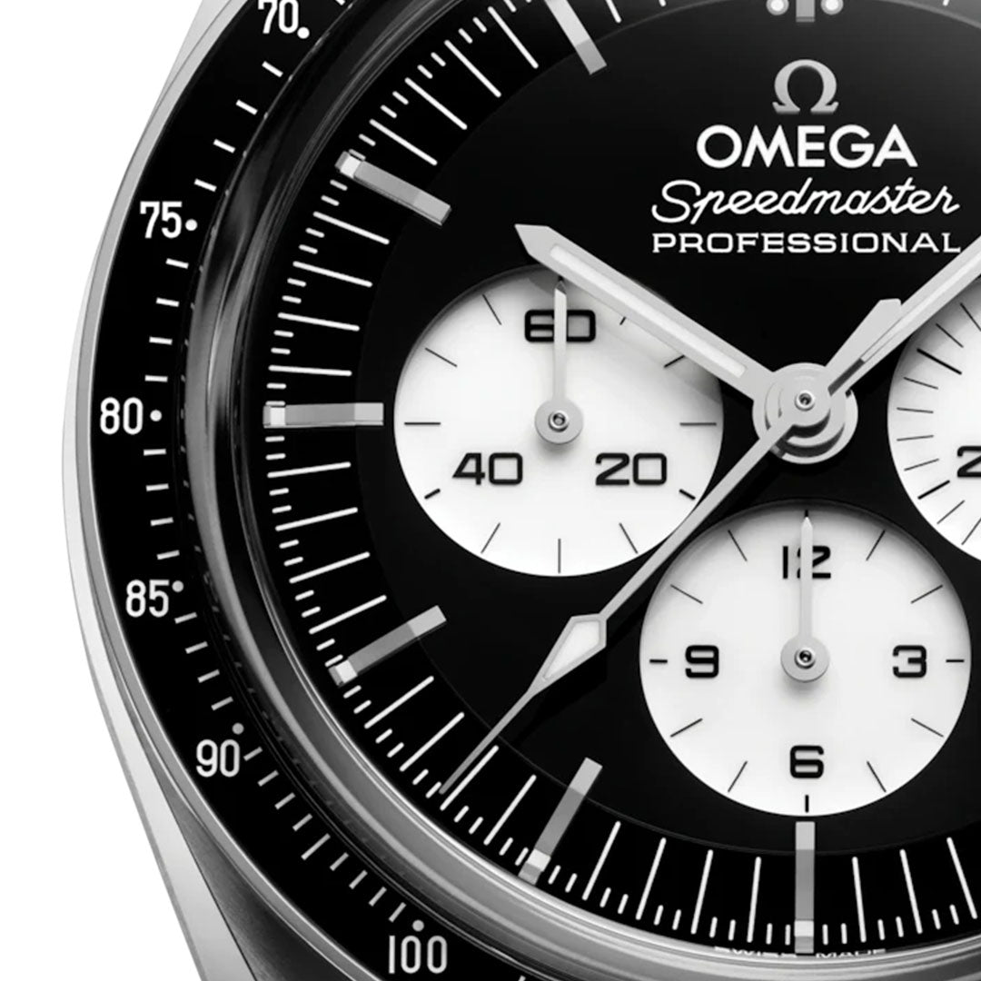 Close-up of the OMEGA Speedmaster Moonwatch Professional Co-Axial Master Chronometer Chronograph 42mm, showing black and white subdials, bold white hour markers, and the iconic OMEGA branding. The time displayed is approximately 1:53:20.