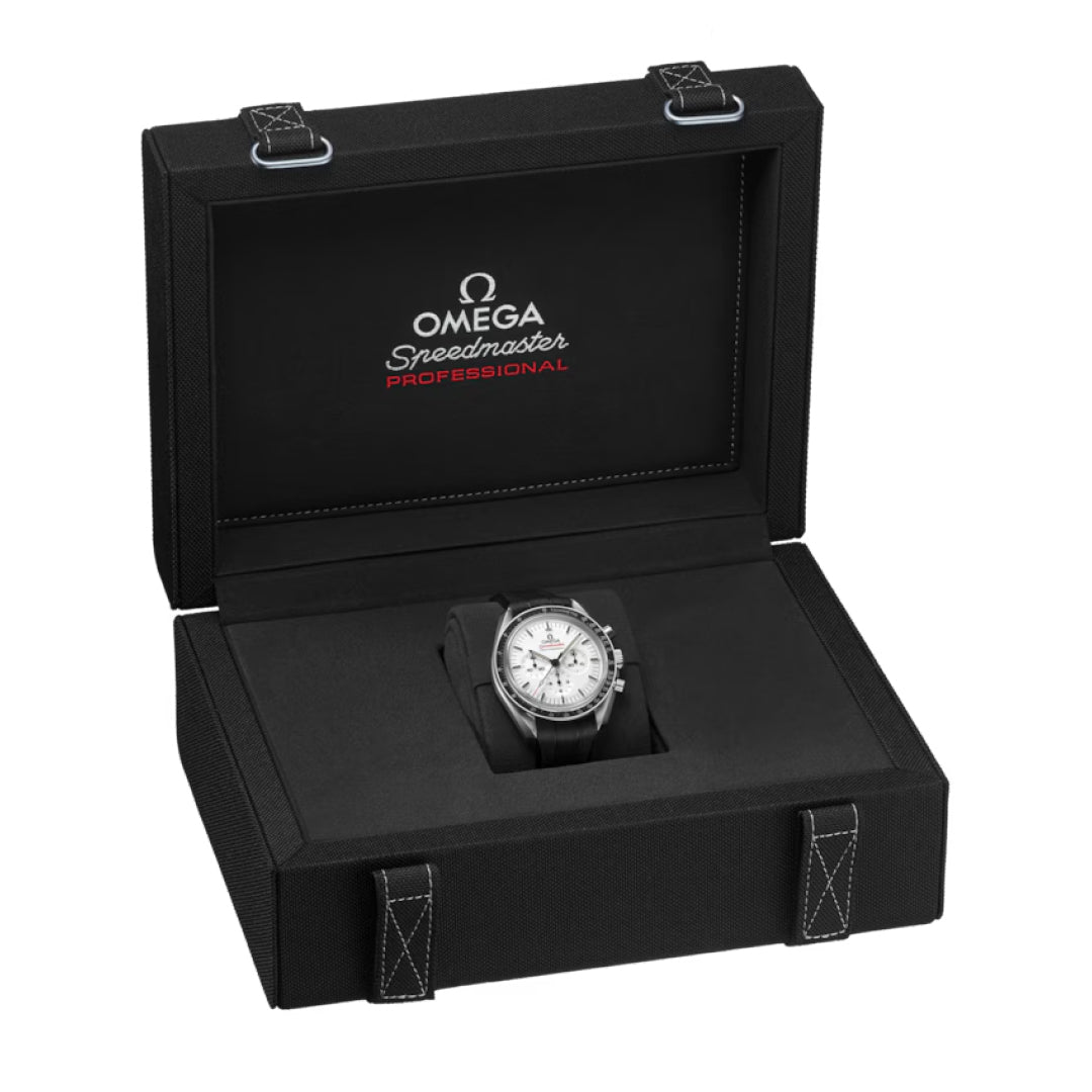 An OMEGA Speedmaster Moonwatch Professional Co-Axial Master Chronometer Chronograph 42mm is shown with a black strap inside an open black presentation box featuring white stitching and the OMEGA logo on the lid.