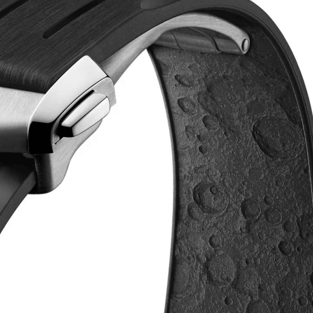 Close-up of the OMEGA Speedmaster Moonwatch Professional 42mm, featuring a black, moon-textured strap with a silver buckle and case.