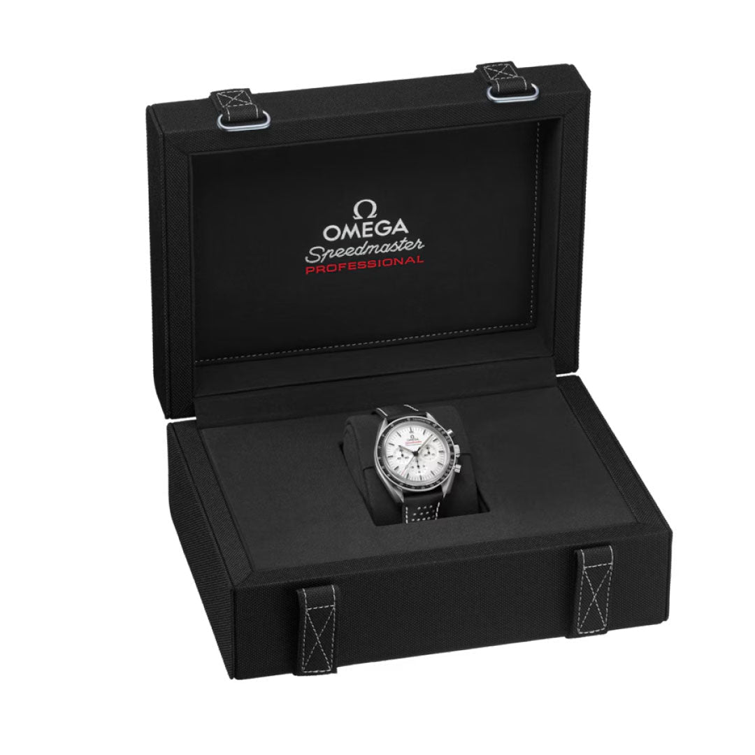 The OMEGA Speedmaster Moonwatch Professional Co-Axial Master Chronometer Chronograph 42mm, featuring a silver case and black strap, is displayed in an open black box with white stitching and “OMEGA Speedmaster Professional” inside the lid.