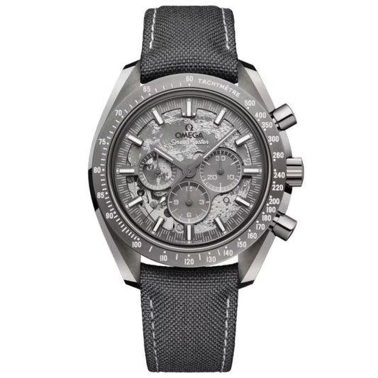 The OMEGA Speedmaster Dark Side of the Moon Co-Axial Master Chronometer 44.25mm Watch features a textured grey dial, visible gears, silver hands and markers, black tachymeter bezel, and a dark grey fabric strap in bold grey ceramic.