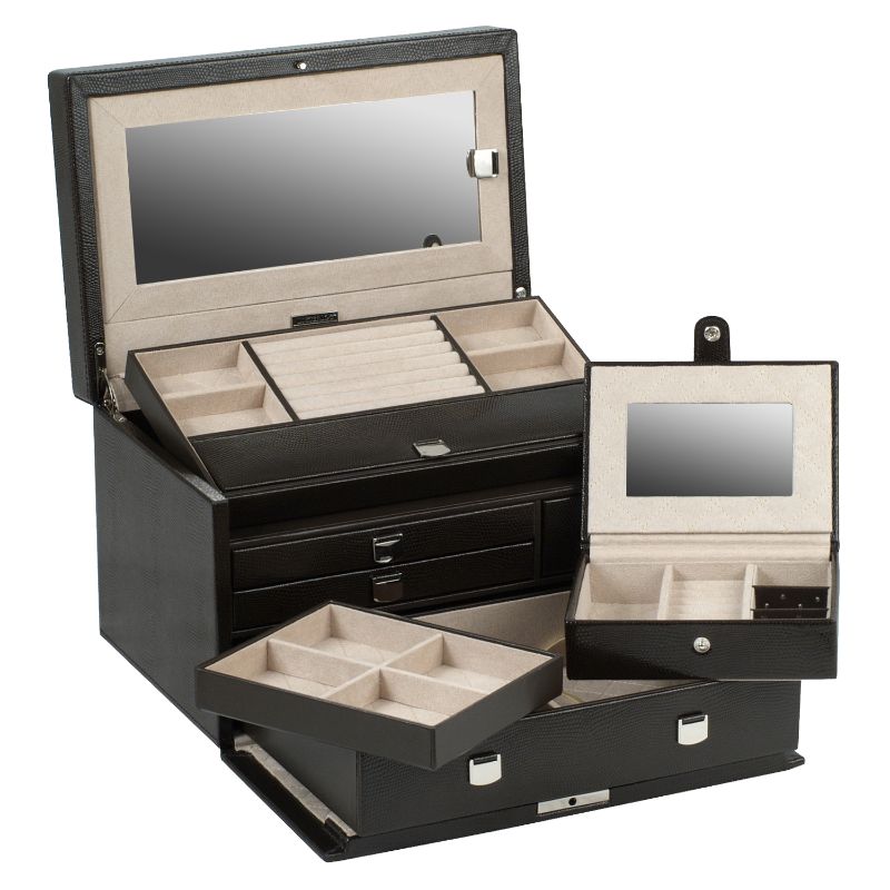 The WOLF 1834 London Medium Jewellery Box is open, showcasing multiple compartments in its black lizard-embossed leather finish, perfect for organizing rings, necklaces, and other items. This exquisite jewellery box also features a mirror on the lid and a pull-out drawer for extra storage space, all enhanced by the LusterLoc™ lining designed to protect your precious treasures.