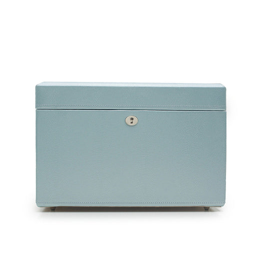 The WOLF 1834 London Jewellery Box by WOLF is a light blue rectangular piece with a lizard embossed leather surface, highlighted by a small silver lock on the front. It is photographed against a plain white background, displaying its elegant design and featuring LusterLoc™ technology.