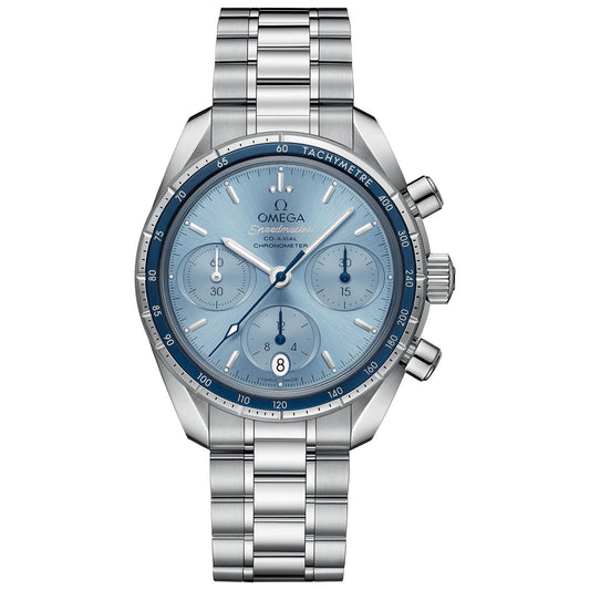 The OMEGA Speedmaster 38 Co-Axial Chronometer Chronograph 38mm Watch features a captivating blue dial with three subdials, a date display at the 6 o'clock position, and a tachymetric scale on its bezel. Paired with a stainless steel bracelet, this silver timepiece by OMEGA elegantly exemplifies precision and style.