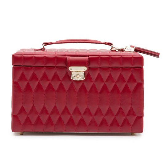 The WOLF 1834 Caroline Red Large Jewellery Box is an elegant red quilted jewelry case made from diamond quilted leather, complete with a handle and metallic latch closure. It features small feet for an elevated stance and incorporates LusterLoc™ technology for enhanced protection.