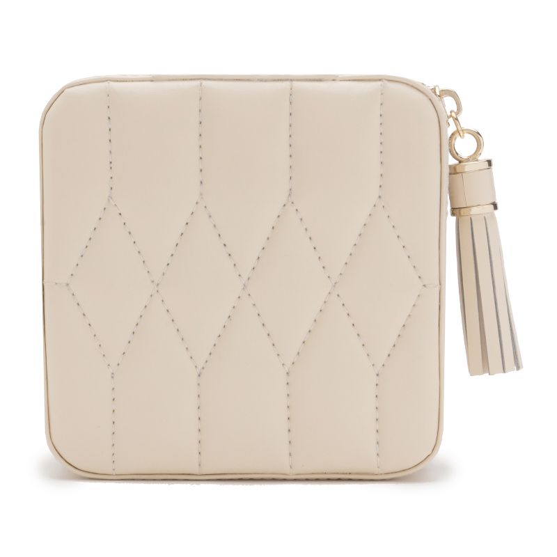 Introducing the WOLF 1834 Caroline Zip Travel Case: an elegant cream square leather bag crafted with diamond quilted stitching and adorned with a gold zipper. This sophisticated leather travel case features a matching tassel attached to the zipper pull for added style.