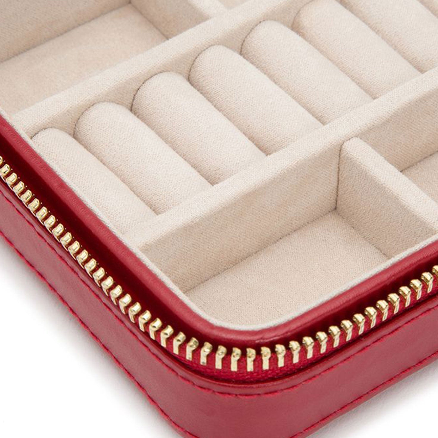 Here's a close-up of the WOLF 1834 Caroline Zip Travel Case, showcasing its open compartments lined with beige fabric to prevent tarnish. The striking red exterior is enhanced by a gold zipper and diamond quilted leather, adding an elegant touch to your travels.