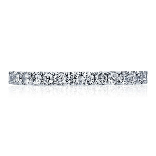 A Tacori 18K white gold round brilliant French pavé diamond anniversary ring features a seamless line of sparkling, round-brilliant diamonds set in a luxurious white metal band, exemplifying elegant design curated by TACORI gemologists.