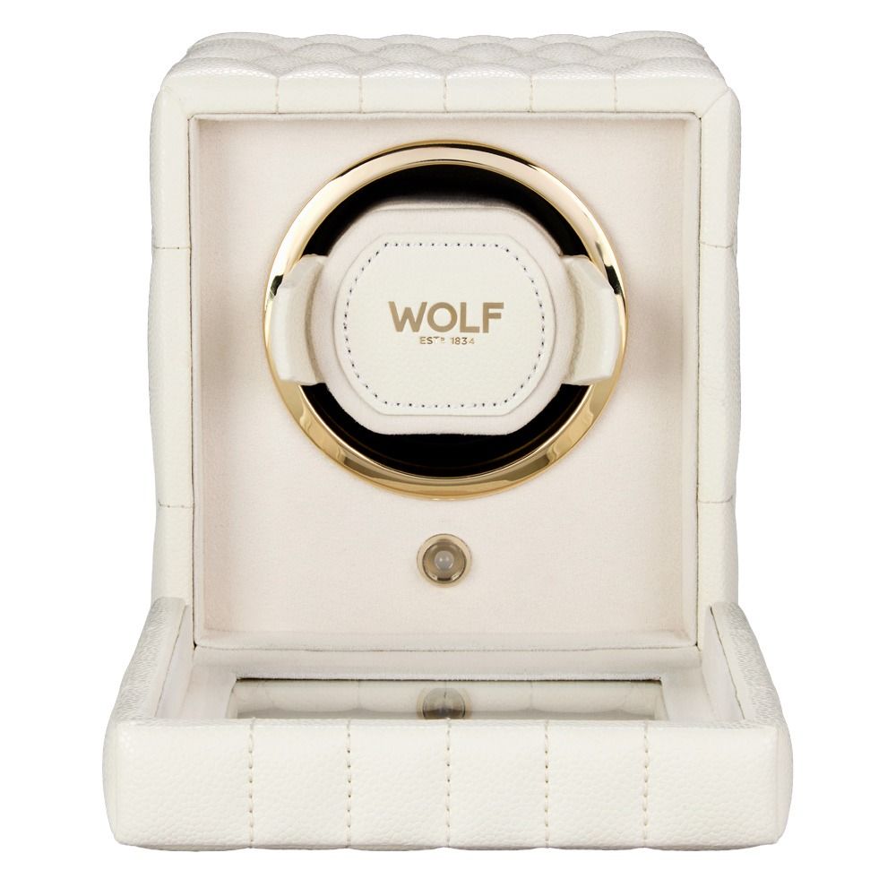 The WOLF 1834 Lauren Single Watch Winder in ivory, a quilted single winder with gold accents and the “WOLF” brand name on the front holder, is shown with its hinged panel open—an elegant alternative to classic ebony macassar styles.