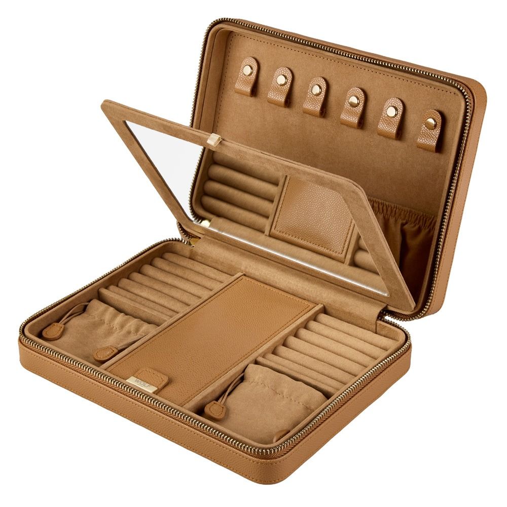 The WOLF 1834 Lauren Large Zip Case Carmel by WOLF is a tan leather jewelry organizer with a secure zipper closure. When opened, it reveals organized storage including ring rolls, compartments, necklace hooks, and a clear window on the lid. The interior is lined with matching fabric and features thoughtfully arranged sections, offering an elegant and functional solution for keeping your accessories secure while traveling.