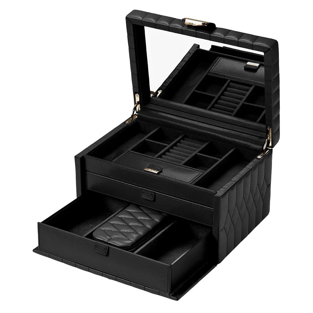 The WOLF 1834 Lauren Med Jewellery Box Black is a beautifully crafted black quilted leather jewelry case featuring an open lid with a large built-in mirror, multiple top compartments, and a pull-out drawer below for organizing your jewelry and accessories. Inspired by the elegance of the Marrakesh Travel Case and equipped with WOLF’s LusterLoc technology, this box from WOLF protects your collection while keeping it stylishly organized.