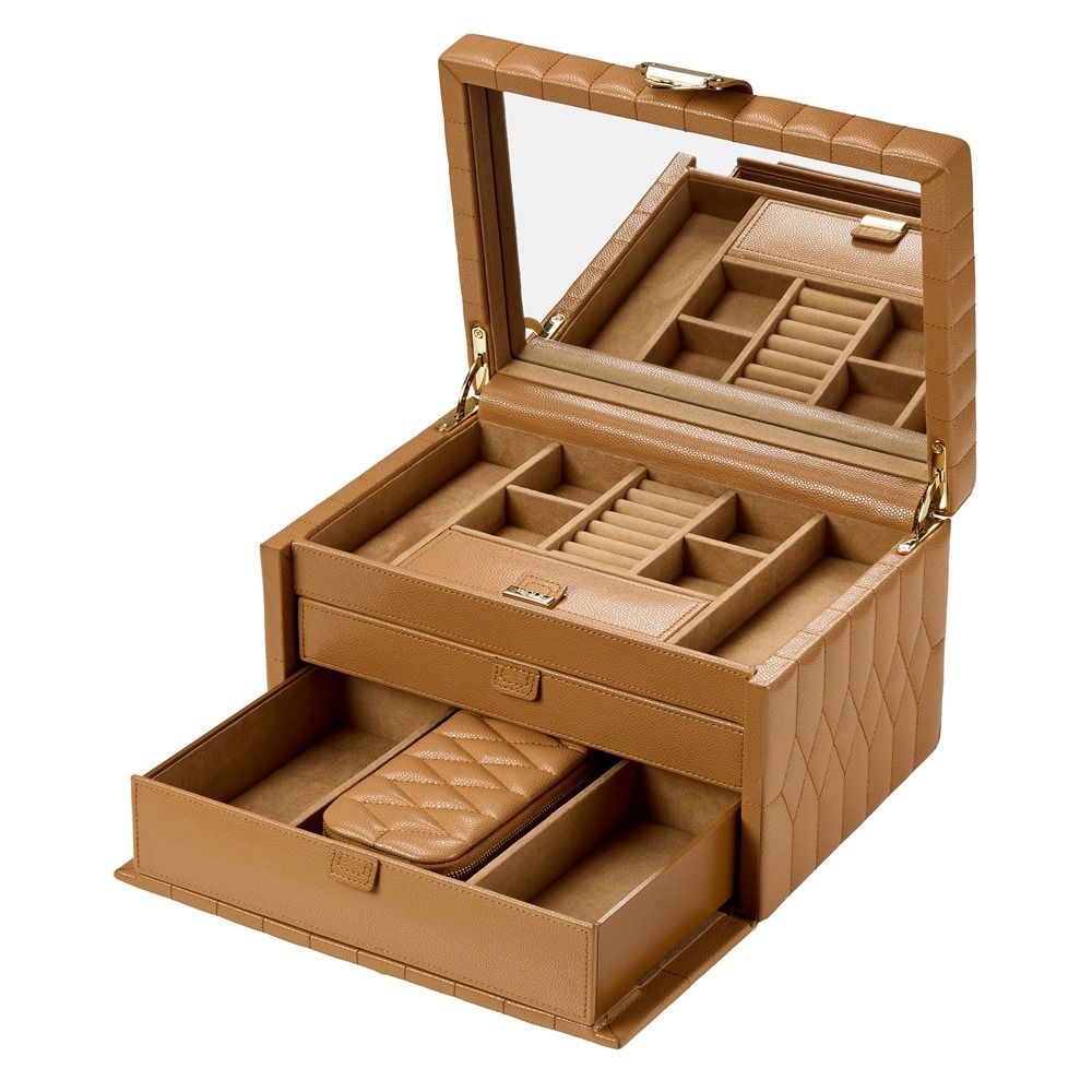 The WOLF 1834 Lauren Med Jewellery Box Carmel is a sophisticated tan leather jewelry box featuring a quilted pattern, an interior mirror in the lid, spacious compartments, and a pull-out drawer with additional storage sections for rings, necklaces, and other accessories. This elegant anti-tarnish jewelry box from WOLF ensures your treasures stay protected and organized wherever you go.