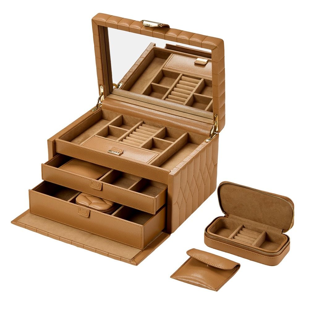 The WOLF 1834 Lauren Med Jewellery Box Carmel by WOLF is a tan leather jewelry case featuring a large mirror, multiple compartments, and two pull-out drawers. Displayed beside it is the matching Marrakesh Travel Case. This anti-tarnish jewelry box is thoughtfully designed for both style and organization.