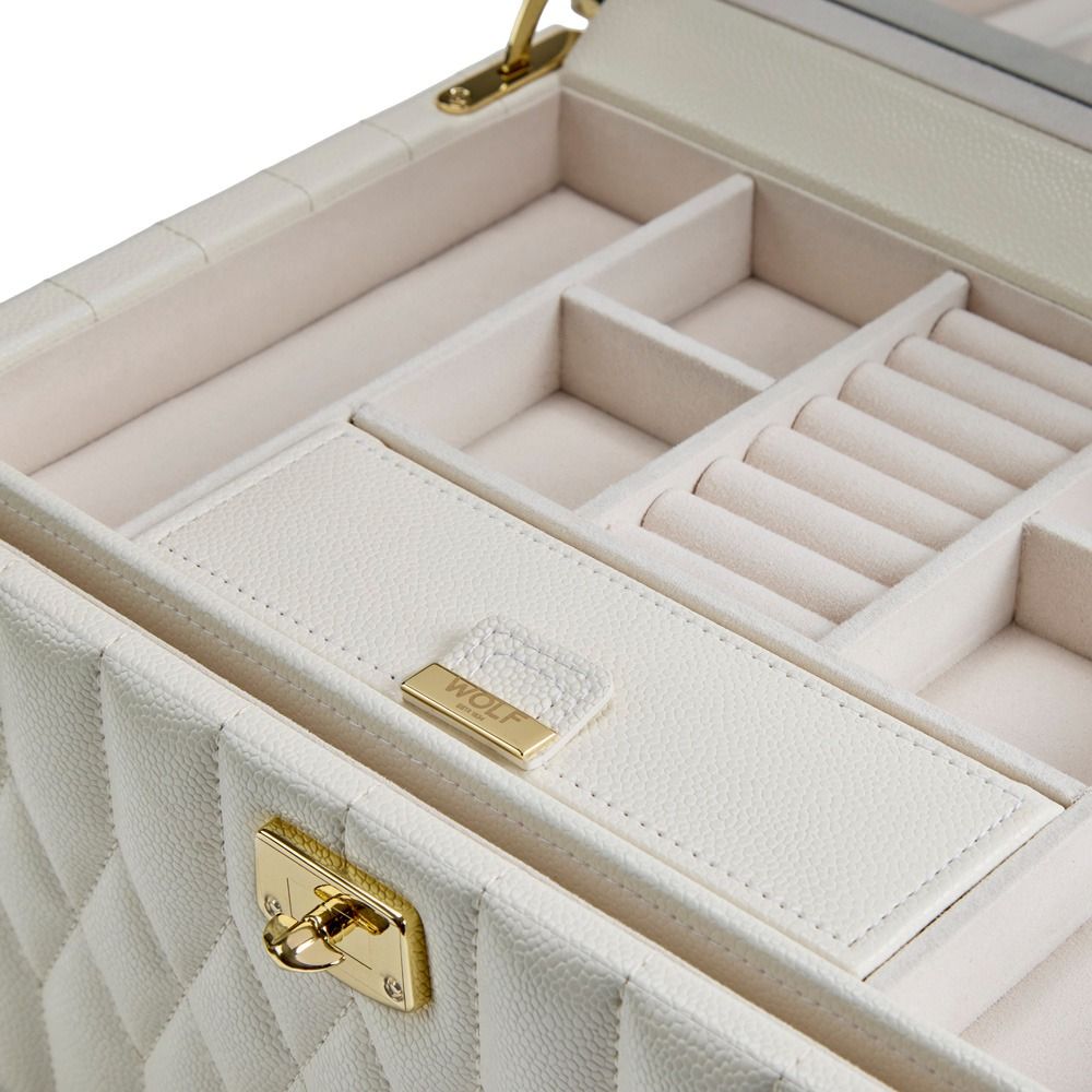 WOLF 1834 Lauren Med Jewellery Box Ivory by WOLF features white quilted leather with gold hardware and opens to reveal multiple compartments lined with soft beige fabric for rings, earrings, and other jewelry. This elegant travel case includes anti-tarnish jewelry storage to keep your treasures safe and organized.