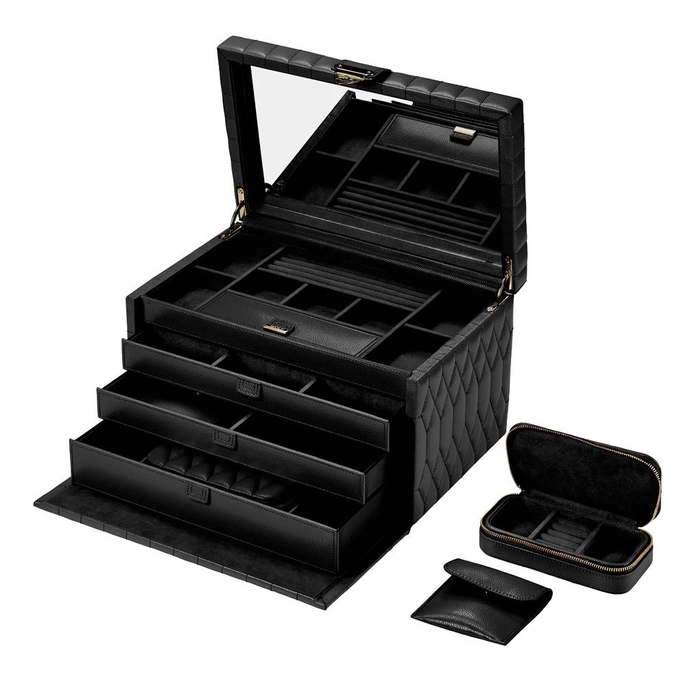 The WOLF 1834 Lauren Large Jewellery Box Black by WOLF features a black diamond quilted leather exterior, an open lid with a mirror, multiple compartments, three open drawers, and comes with two smaller matching cases beside it—offering both elegance and tarnish-resistant storage for your jewellery.