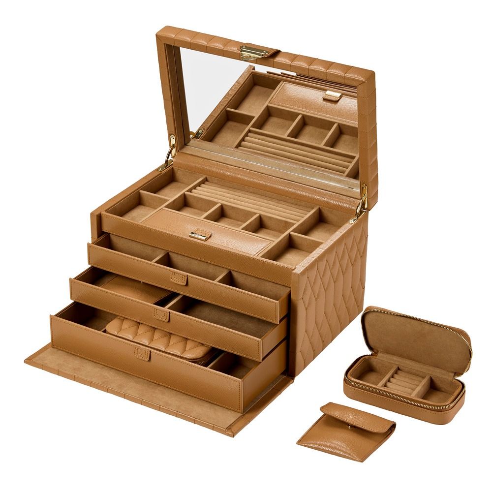 A tan diamond-quilted leather WOLF 1834 Lauren Large Jewellery Box in Carmel, featuring a mirror, multiple open drawers, compartments for rings and earrings, and two matching small travel cases nearby. This elegant piece from WOLF is lined with LusterLoc to help protect your treasured jewellery from tarnish.