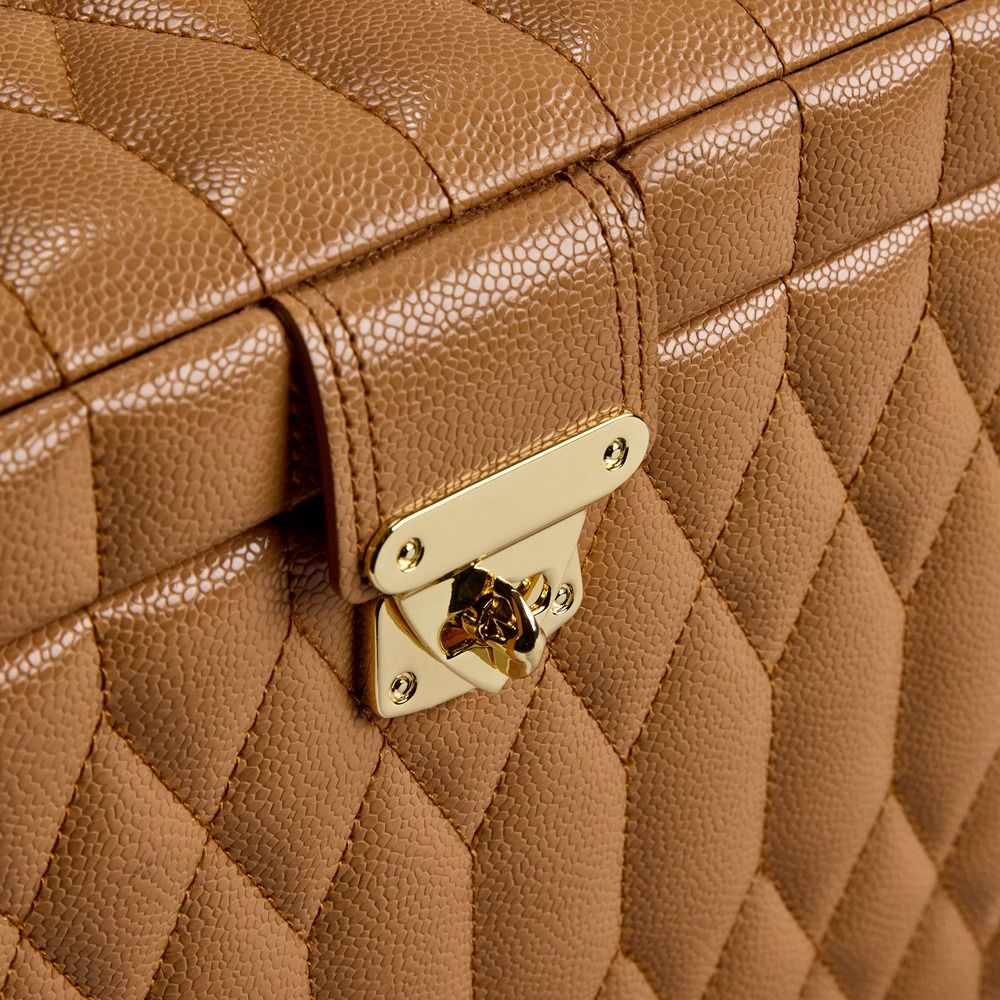 Close-up of the WOLF 1834 Lauren Large Jewellery Box in Carmel, crafted from rich brown diamond-quilted leather with textured stitching and finished with a gold clasp.