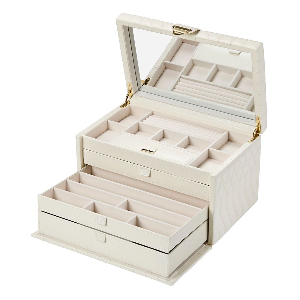 The WOLF 1834 Lauren Large Jewellery Box in Ivory features multiple compartments and a spacious mirror inside the lid, with elegant gold hinges and a diamond-quilted leather exterior for a sophisticated look. Designed by WOLF with tarnish prevention technology, this jewellery box keeps your valuables safe, organized, and beautifully displayed.
