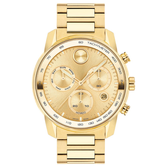 The Movado BOLD Verso Chronograph Quartz 44mm Watch features a gold-toned stainless steel band and face, three subdials for day, date, and 24-hour time, a tachymeter bezel, and two side buttons. Brand: Movado.