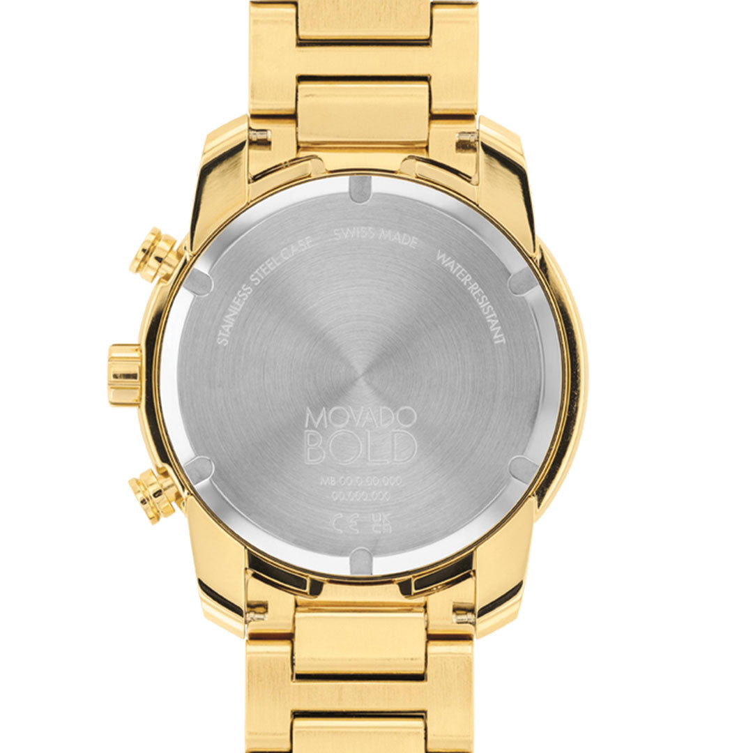 A close-up of the back of a Movado BOLD Verso Chronograph Quartz 44mm watch shows its yellow gold stainless steel case, Swiss Made engraving, water resistance label, and gold metal link band.