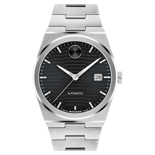 The Movado BOLD Quest Automatic 39mm Watch features a stainless steel case with a black dual texture dial, silver hour markers and hands, a date window at 3 o'clock, and a circular marker at 12 o'clock. Its brushed metal bracelet complements the self-winding movement for effortless sophistication.