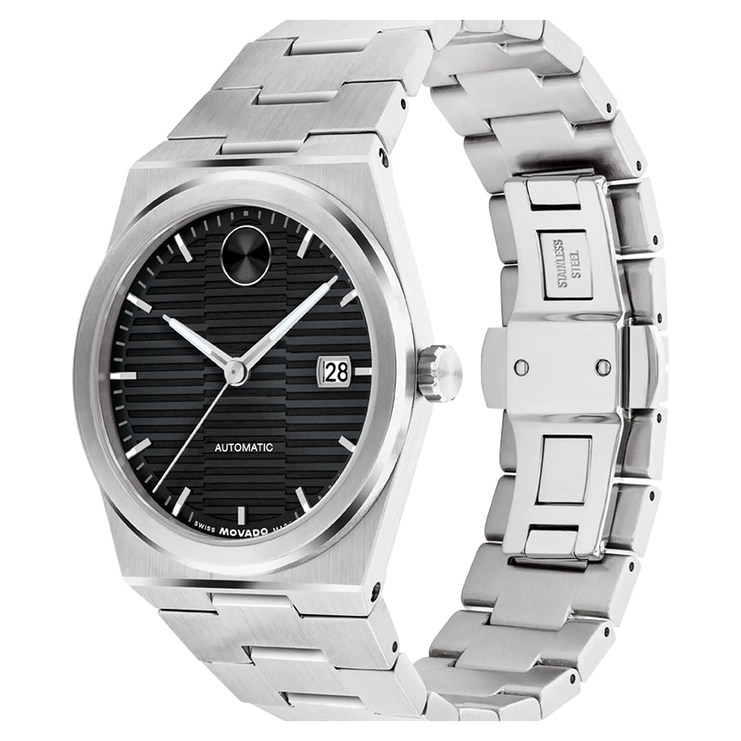 The Movado BOLD Quest Automatic 39mm Watch by Movado boasts a sleek stainless steel design with a black dual-texture dial, silver hour markers, and a date window. Its adjustable bracelet complements the exhibition caseback displaying the self-winding movement, accented by "Automatic" on the dial.