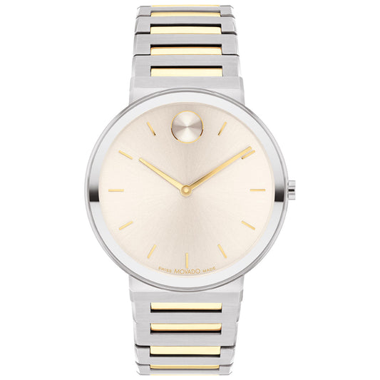 The Movado BOLD Horizon Quartz 40mm Watch features a stylish design with a metallic silver and gold-tone band. Its round dial is minimalist, showcasing golden markers and a single dot at the 12 o'clock position, while the silver case adds to its elegant appeal.