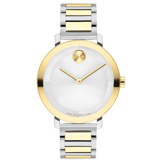 The Movado BOLD Evolution 2.0 Quartz 34mm Watch features a chic silver and gold stainless steel bracelet, minimalist white dial with a gold bezel, signature single dot at 12 o’clock, and two gold hands for an elegant look.