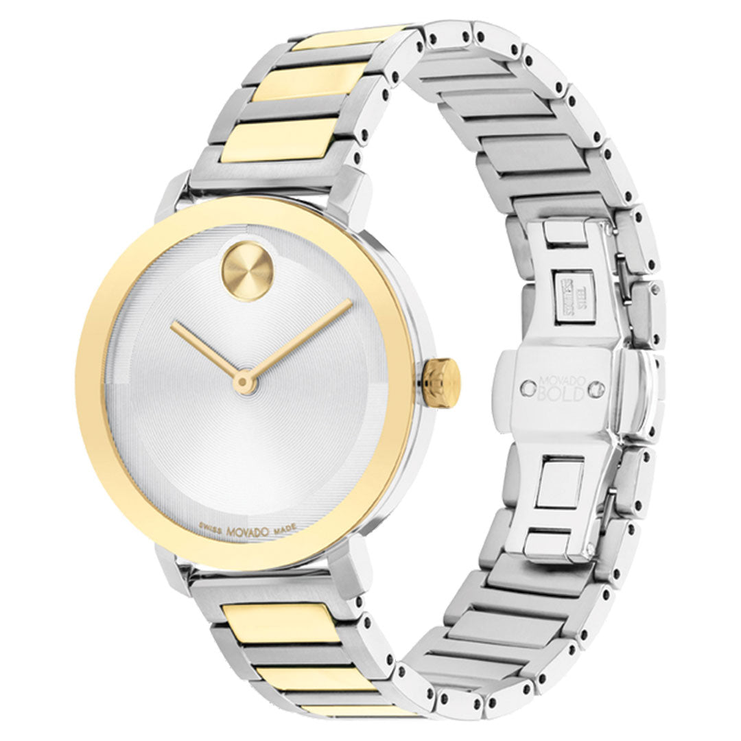 The Movado BOLD Evolution 2.0 Quartz 34mm Watch features a round silver face, gold bezel, minimalist gold hands, and a two-tone silver and gold link band—an elegant stainless steel design from Movado.