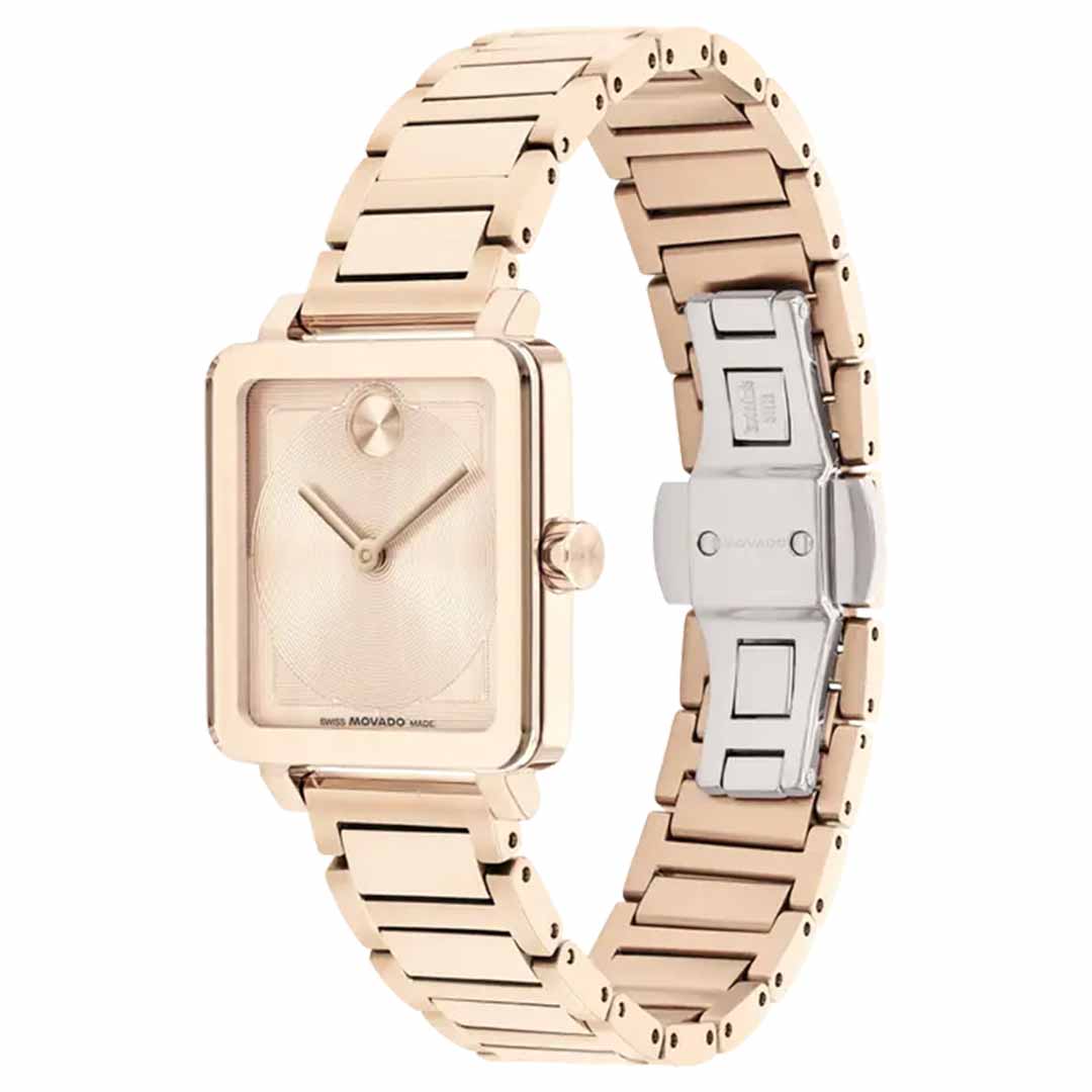 The Movado BOLD Evolution 2.0 Quartz watch features a square face and minimalist design, highlighted by its bold case and micro-textured dial. It comes with a gold link bracelet, a simple two-hand dial, and a silver clasp engraved with the Movado brand name. This watch's sleek, modern appearance makes it perfect for any occasion.