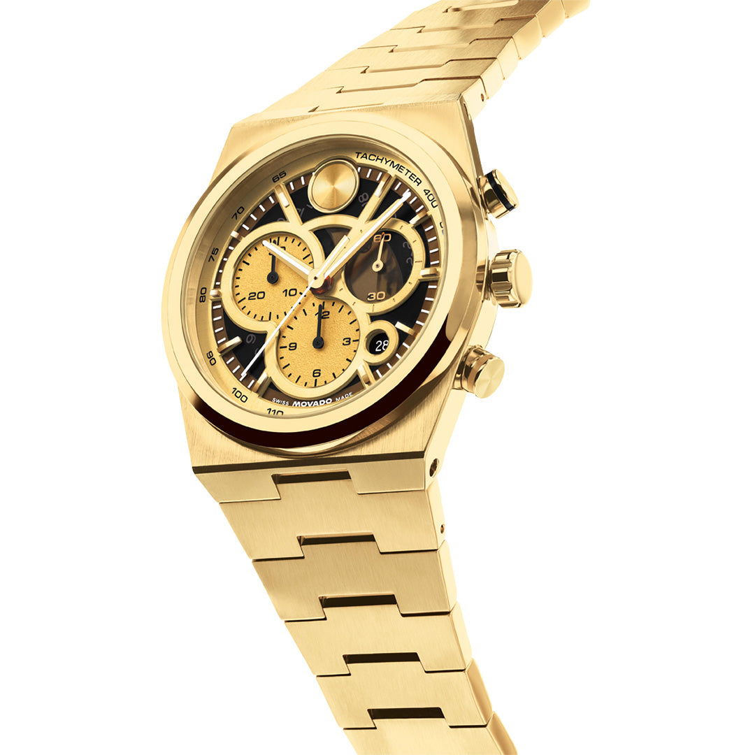 Gold-tone Movado BOLD Quest Chronograph Quartz 40mm Watch with a black skeleton dial, three sub-dials, and an integrated link bracelet.