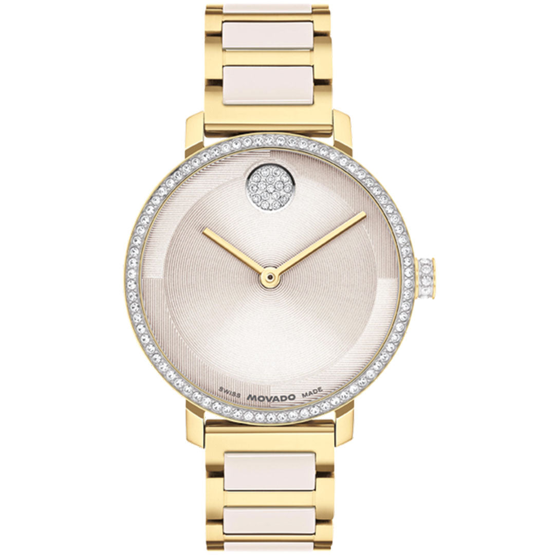 The Movado BOLD Evolution 2.0 Quartz 34mm Watch features a round face, crystal-set bezel, diamond accents at 12 o’clock, gold hands, and a two-tone metal bracelet by Movado.