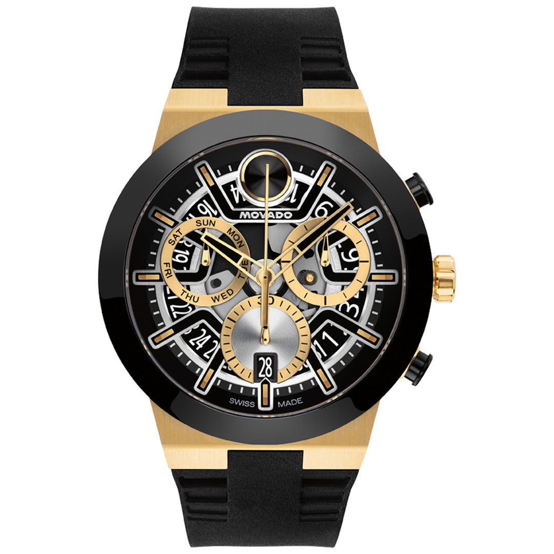 A Movado BOLD Fusion Chronograph Quartz 44.5mm watch in gold and black, featuring a black rubber strap, open skeleton dial with day and date indicators, yellow gold ion-plated accents, exposed gears in a modern design, and the Swiss Made label at the bottom.