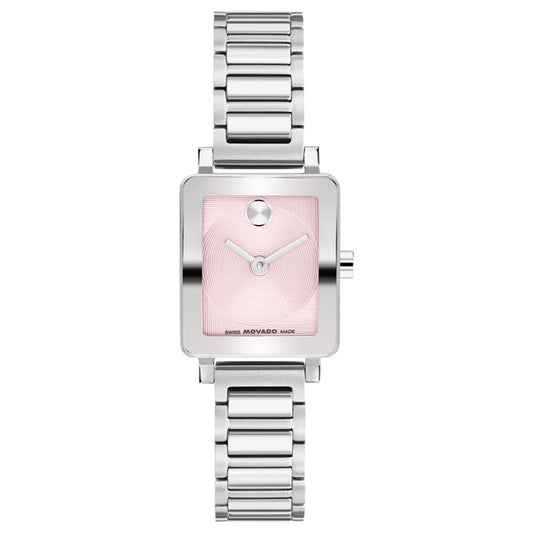 The Movado BOLD Evolution 2.0 Mini Quartz Watch for women features a silver-tone stainless steel case (19mm x 22.5mm), a square pink minimalist dial with a microtextured finish, silver hands, and a signature single dot at 12 o’clock, complemented by a sleek stainless steel link bracelet.