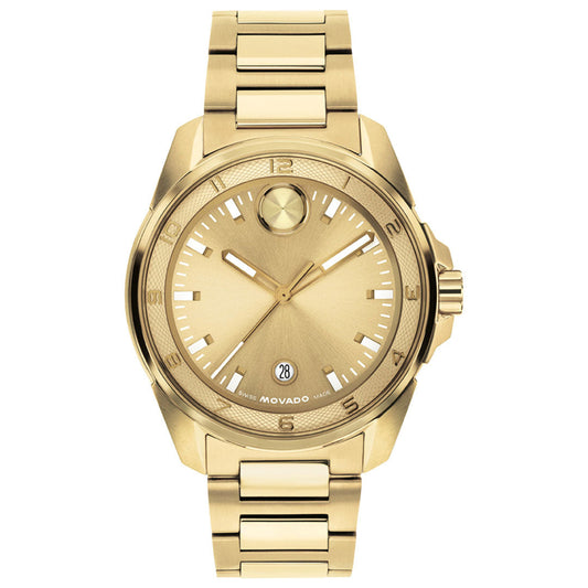 The Movado BOLD Verso S Quartz 42mm Watch features a yellow gold case, metal band, and round dial with minimalist hour markers and a date display at the 6 o’clock position. This elegant sport watch by Movado boasts Swiss-made movement, seamlessly blending classic design with precision craftsmanship.
