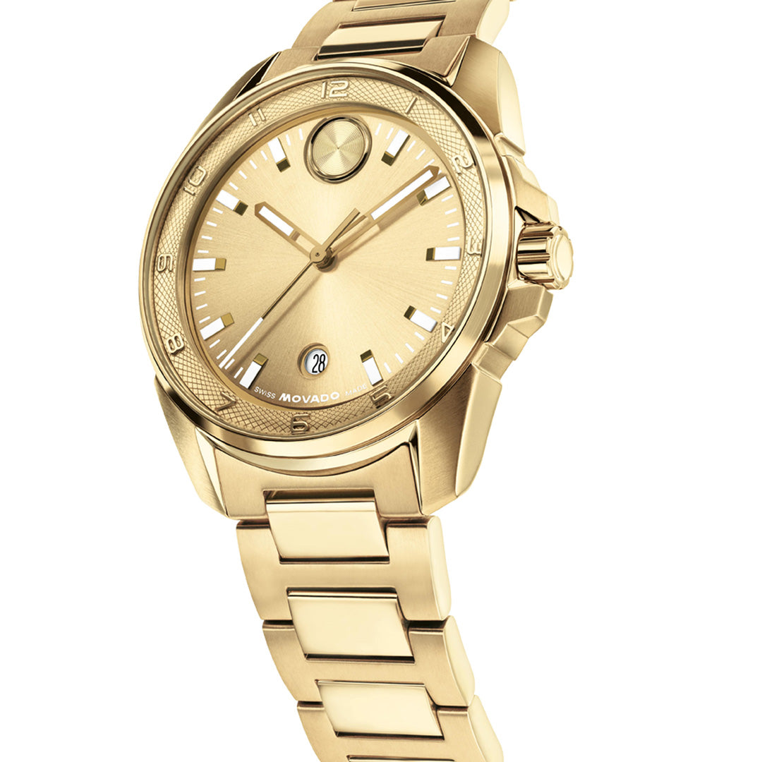 Introducing the Movado BOLD Verso S Quartz 42mm Watch, a striking yellow gold timepiece featuring a metal band, round face, three hands, minimalist hour markers on a gold dial, and a date display at 6 o’clock. Crafted by Movado with Swiss-made movement for exceptional precision.