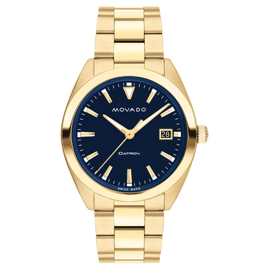 The Movado Heritage Series Datron Quartz 39mm Watch showcases a navy blue dial with Swiss Super-LumiNova geometric hour markers and a date window at 3 o'clock. The "Movado" brand name is elegantly displayed at the top, while its opulent look is finished with a yellow gold link bracelet.