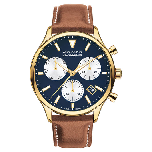 Featuring a yellow gold ion-plated stainless steel case and a brown leather band, the Movado Heritage Series Calendoplan Quartz 43mm Watch offers a sophisticated design. Its navy blue dial is elegantly adorned with three subdials for day, date, and time, complemented by gold hour markers and hands. The addition of "Movado" on the dial enhances the elegance of this stylish chronograph timepiece.