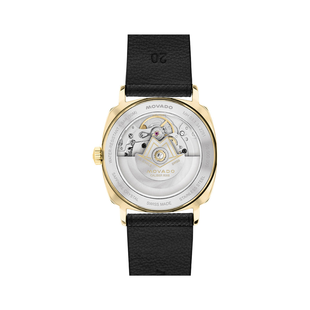 Gold-toned Movado Heritage Kingmatic Automatic 35mm Watch case with an open case back displaying the automatic movement, attached to a black leather strap.