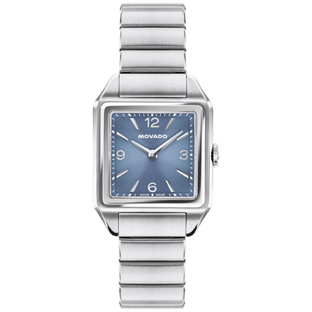 A Movado Heritage 1917 Quartz 25mm x 34.10mm watch with a square stainless steel case, blue face, silver hour markers, and metal link band. This Art Deco-style timepiece displays the time as 1:52.