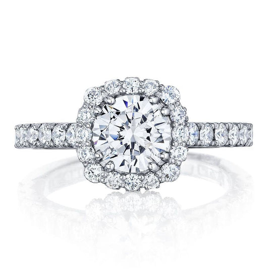 Presenting the Tacori Sculpted Crescent 18K White Gold Cushion Semi Mount Engagement Ring, this exquisite piece showcases a stunning center adorned with a diamond halo and a band intricately embellished with diamonds for added brilliance and sparkle.