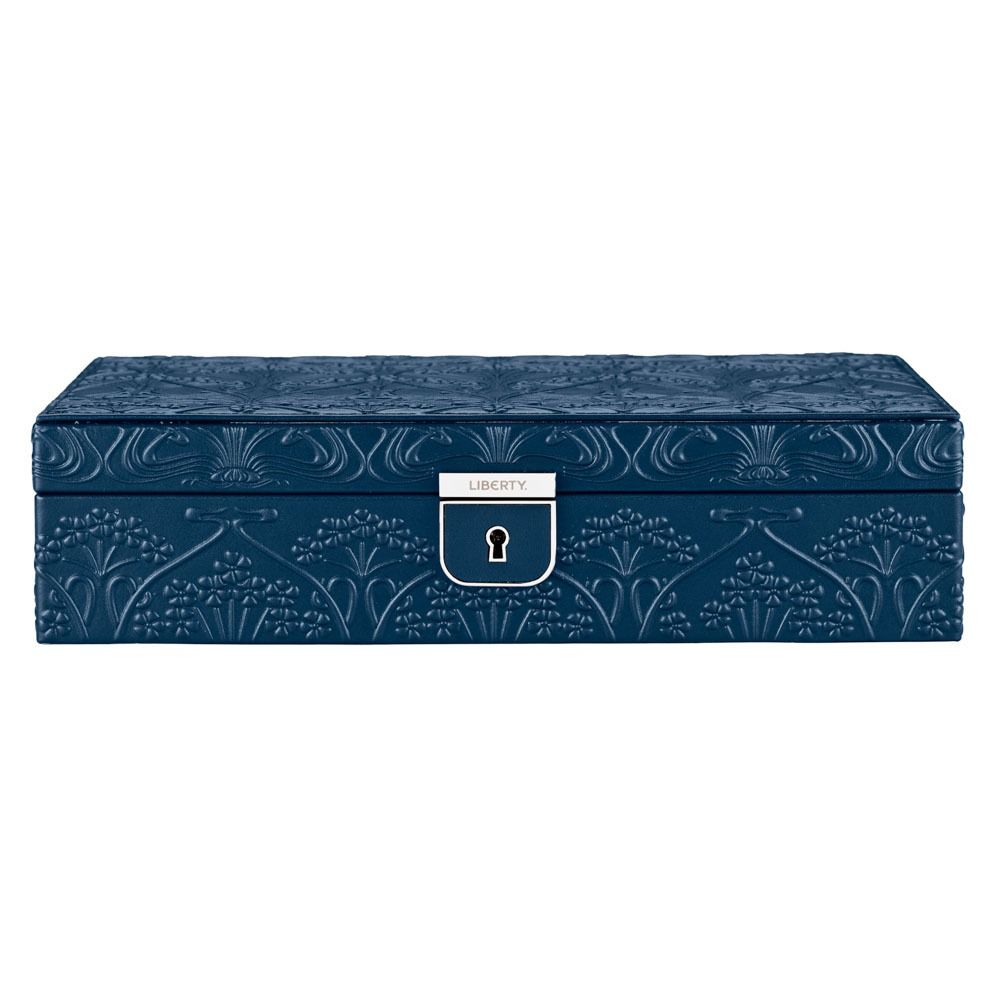A rectangular navy jewellery box from WOLF, crafted in leather embossed with the Liberty All Over Ianthe floral pattern and finished with a silver clasp bearing the “LIBERTY” label on the front.