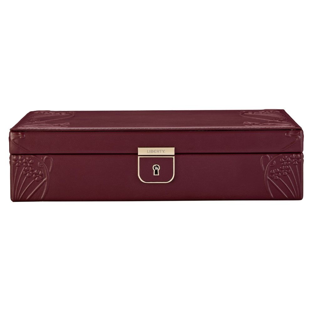 Sure! Here’s the rewritten sentence using your product data: The WOLF 1834 X Liberty All Over Ianthe Medium Jewellery Box in burgundy features a rectangular design with elegant lizard-embossed leather, sophisticated embossed corner details, and a gold-colored lock engraved with “Liberty” on the front. Inside, anti-tarnish storage ensures your jewelry remains pristine.
