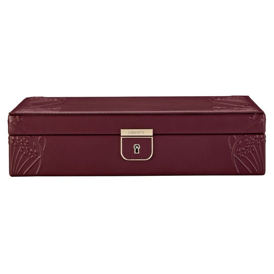 Sure! Here’s the rewritten sentence using your product data: The WOLF 1834 X Liberty All Over Ianthe Medium Jewellery Box in burgundy features a rectangular design with elegant lizard-embossed leather, sophisticated embossed corner details, and a gold-colored lock engraved with “Liberty” on the front. Inside, anti-tarnish storage ensures your jewelry remains pristine.
