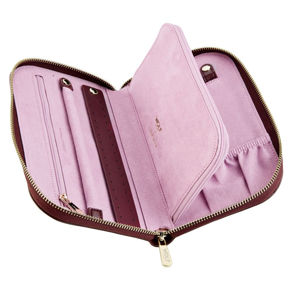 Introducing the WOLF 1834 X Liberty All Over Ianthe Travel Jewellery Portfolio in Burgundy by WOLF, featuring a burgundy recycled canvas exterior and soft pink LusterLoc™ interior, with multiple compartments, straps, and pouches to keep your jewelry organized.